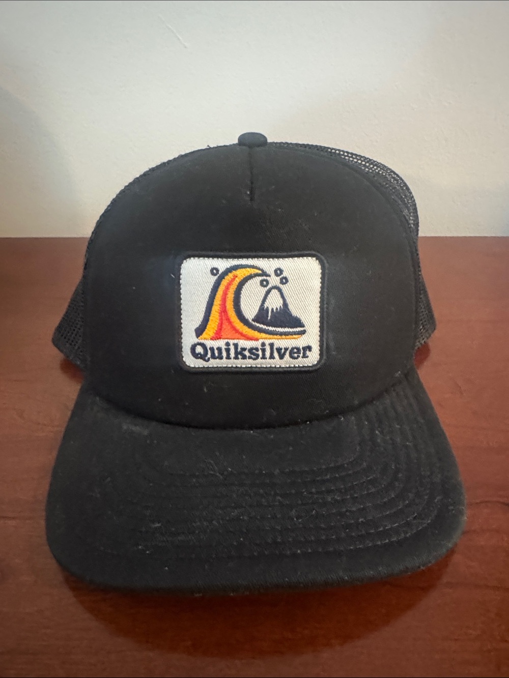 Quiksilver Black Trucker Hat with Yellow Orange and Navy Wave Patch